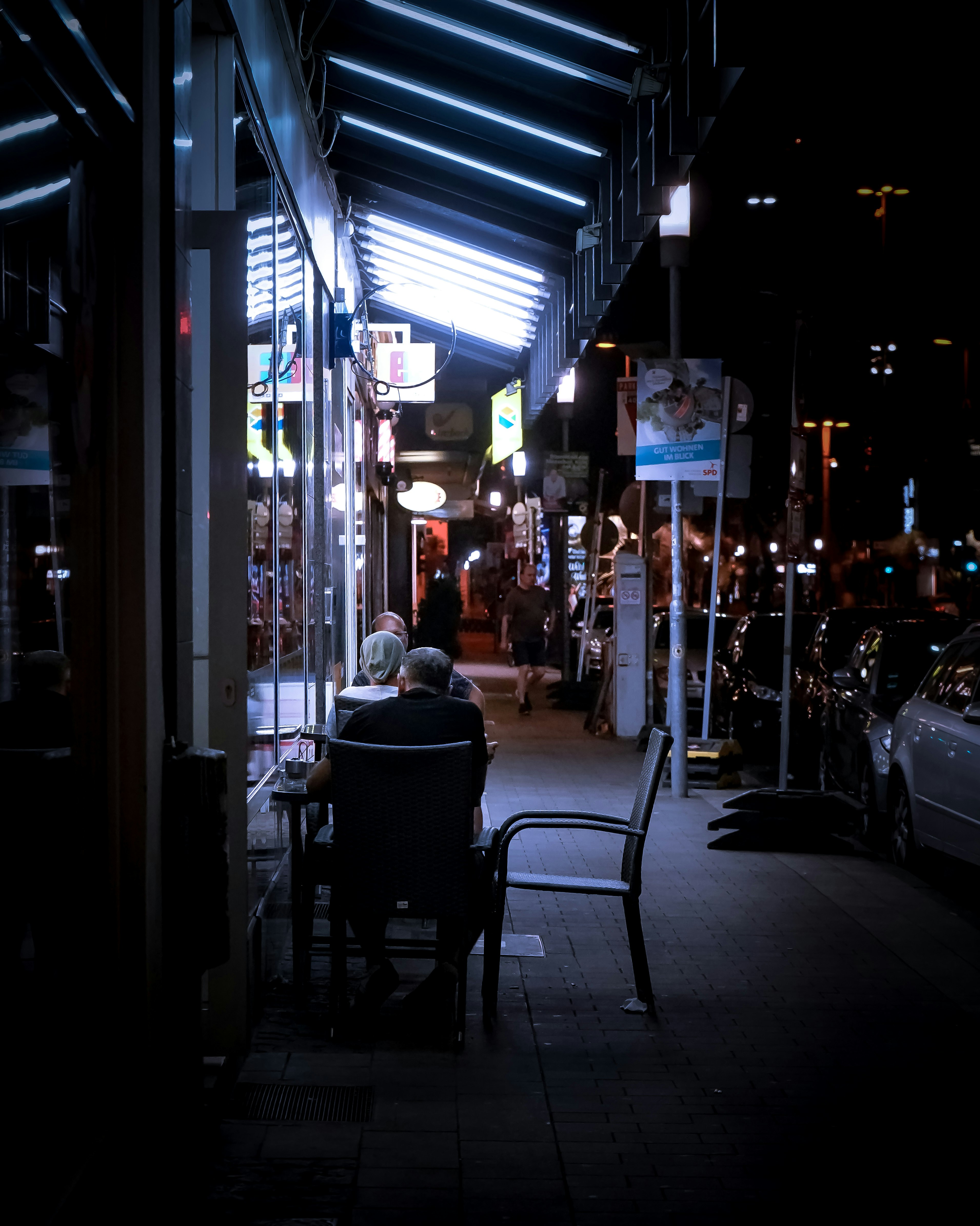 people walking on street during night time